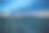 一辆半挂车行驶在两车道的公路上，夕阳下有美丽的云彩图片下载