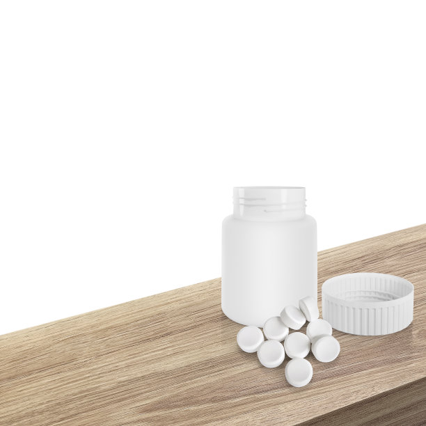 木桌上的药瓶和白色药片图片下载