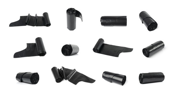 隔离垃圾袋卷。采购产品垃圾包装，新的卷塑料垃圾袋，黑色聚乙烯废物容器图片下载