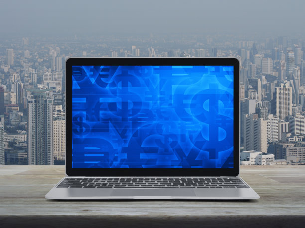 现代笔记本电脑屏幕上的金融货币符号图片下载