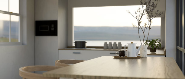 在现代白色厨房的木制餐桌上复制空间。图片下载