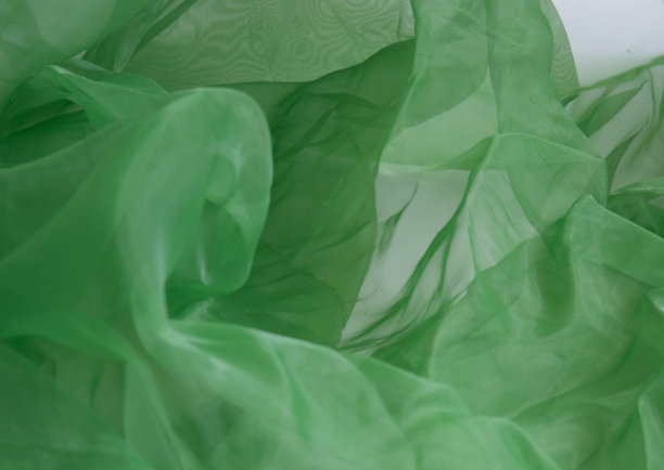 绿色欧根纱织物的抽象背景图片下载