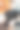 一个年轻人在餐馆里拿着一份纸质菜单。图片下载