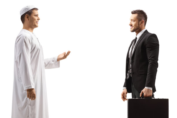 一个阿拉伯人正在和一个商人谈话的侧面照图片下载
