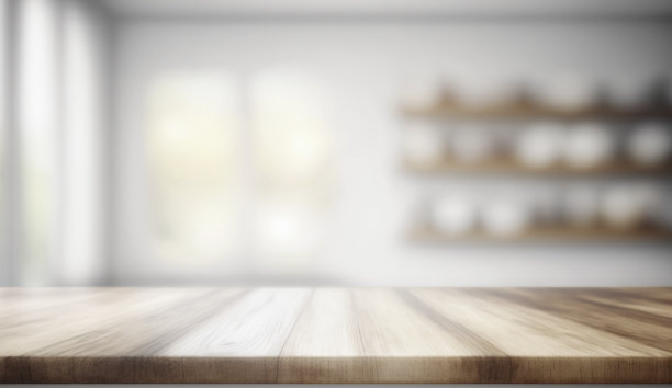 木制桌面与模糊的白色现代厨房背景。模拟了图片下载