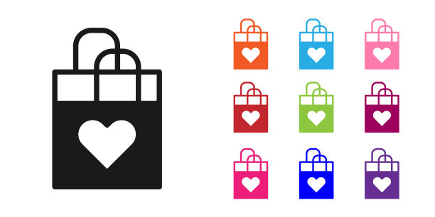 黑色购物袋与心脏图标隔离在白色背景。购物袋店爱如心icon。情人节快乐。设置图标彩色。向量图片下载
