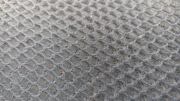 摩托车座椅上的网格纹理。接近透气网摩托车座套。用来遮挡太阳的热量图片下载