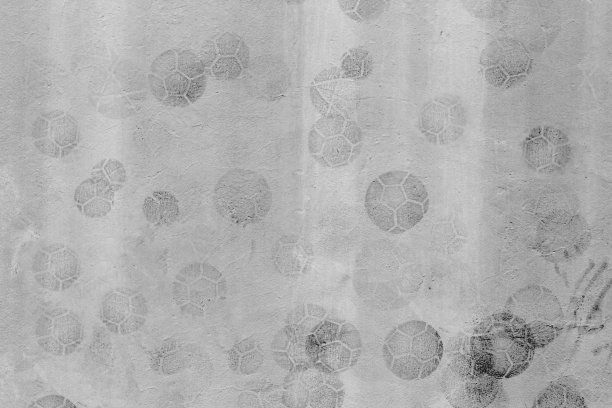 水泥背景上印着足球图案，墙上印着足球泥图片下载