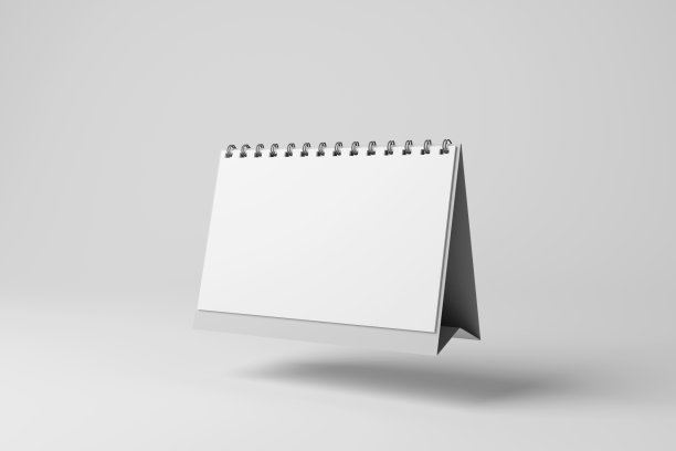 白色的桌面月历漂浮在半空中，在灰色单色的白色背景上投下阴影。说明业务日程安排和约会的概念图片下载