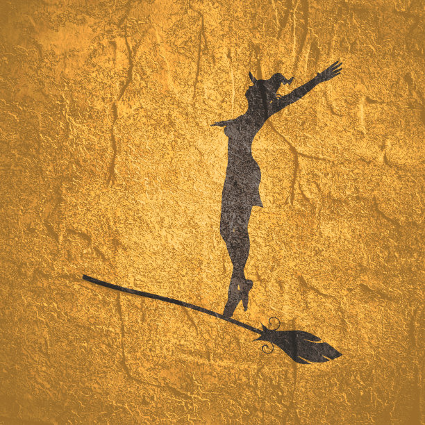 万圣节的节日背景。骑在扫帚上的年轻女巫的剪影图片下载