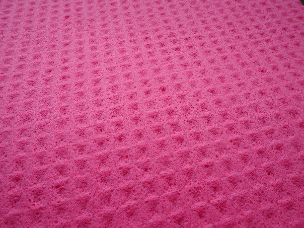 海绵纤维海绵纹理图案表面特写粉红色背景图片下载