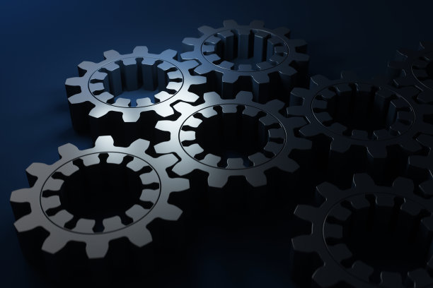 金属齿轮在蓝色背景上的特写。3d渲染图。图片下载