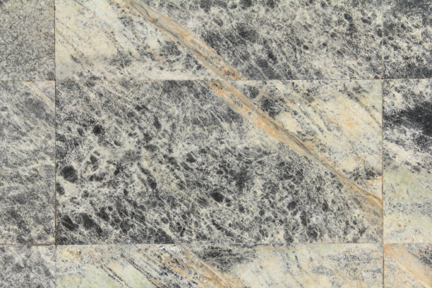 美丽的灰色、白色和淡黄色大理石花纹墙，大理石花纹墙用于室内装饰图片下载