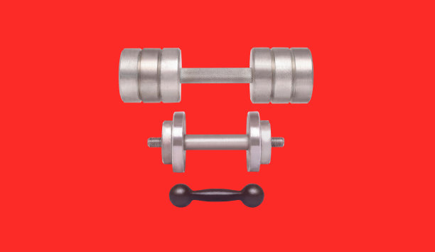 运动器材-不同重量的哑铃孤立在红色背景图片下载