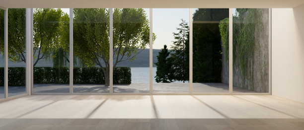 一个现代现代宽敞的空休息室与大玻璃墙与自然景观。图片下载