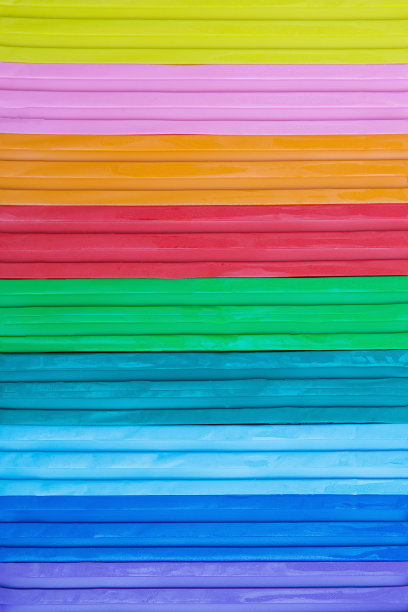 彩色橡皮泥背景。明亮的背景为设计师。垂直图图片下载