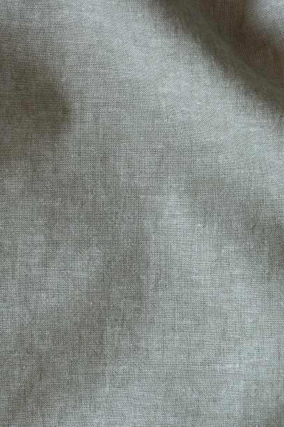 抽象皱麻织物纹理背景。天然淡绿色染色亚麻有机生态纺织品帆布背景。俯视图图片下载
