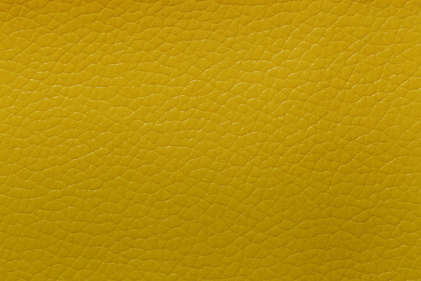 黄色皮革和纹理背景。图片下载