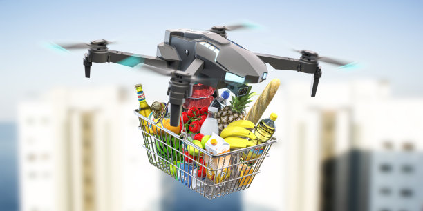 送货无人机在城市背景下装满食品杂货的购物篮…图片下载