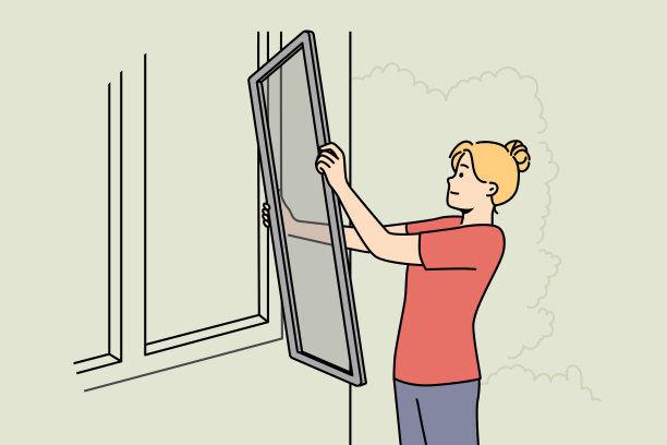 妇女把防虫纱窗放在窗户上图片下载