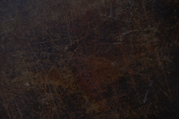 背景与划痕表面纹理。垃圾金属背景。覆盖您的设计与空间复制。有棕色划痕的人造革。高质量照片图片下载