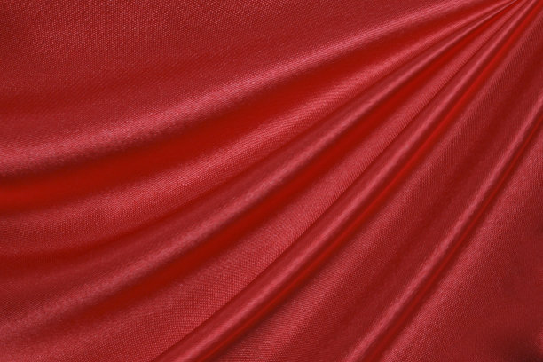 红色丝绸或缎面的奢华面料纹理可以用作抽象的背景。俯视图图片下载