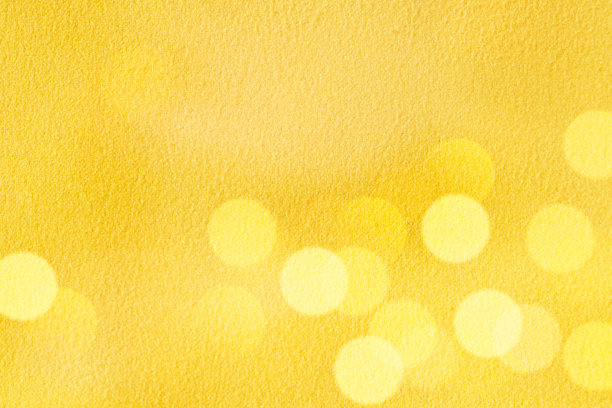 图像的黄色散景抽象织物纹理背景。复古抽象闪闪发光的灯。图片下载