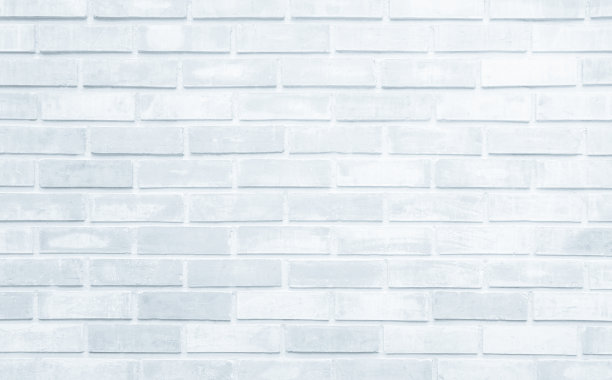 现代白色砖墙背景照片的细节。白色砖墙纹理背景为石瓦块，涂以灰色浅色壁纸现代内外和背景设计。图片下载