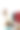 时装设计师女士在现代工作室里用智能手机和笔记本电脑与数码平板电脑交谈，衣服挂在架子上图片下载