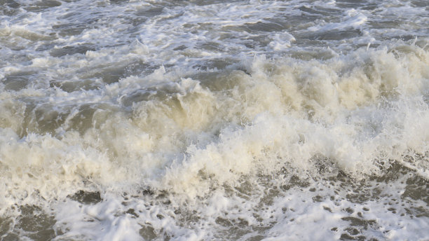 海滩海浪和海泡沫。海水背景。海浪型图片下载
