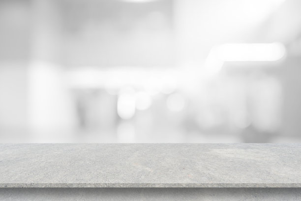 抽象模糊当代室内客厅背景，以白色水泥桌为展示，推广设计内容或产品展示概念图片下载