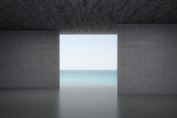 空的混凝土房间，有大海和天空的背景。图片下载