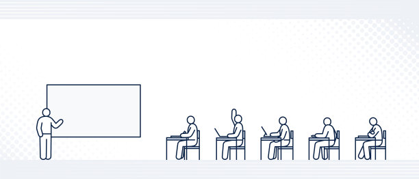 老师坐在学生面前讲课，侧面看学校教室的景象图片下载