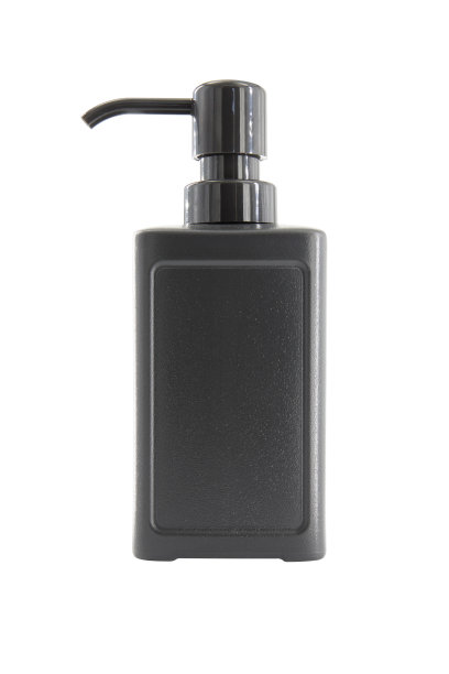 白色背景上隔离的带分配器的黑色化妆品塑料瓶图片下载