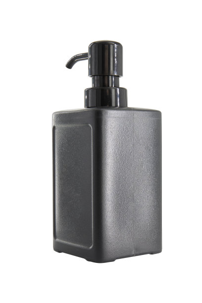 白色背景上隔离的带分配器的黑色化妆品塑料瓶图片下载