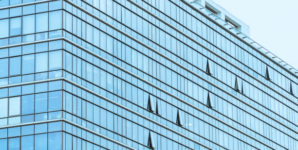 架构细节背景。摩天大楼外。复杂高层建筑的细节。玻璃幕墙建筑图片下载