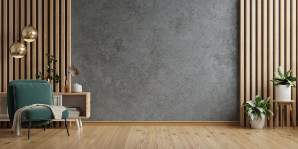 客厅里有绿色扶手椅，背景是空的深色混凝土墙。图片下载