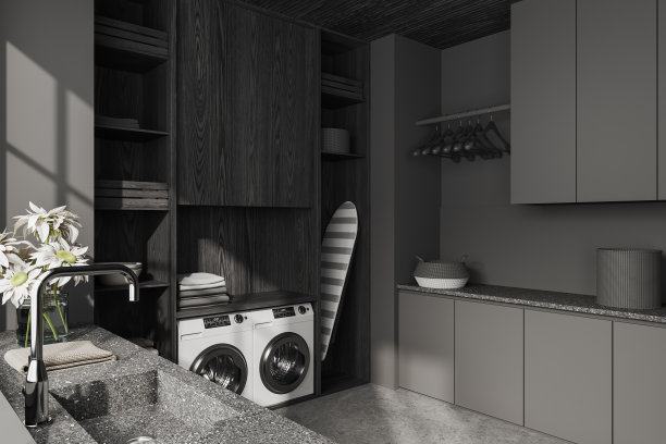 灰色的洗衣房内部，有洗衣机和铁制桌子图片下载