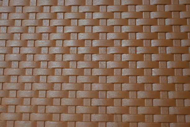 柳条塑料椅上的柳条图案的抽象背景。图片下载