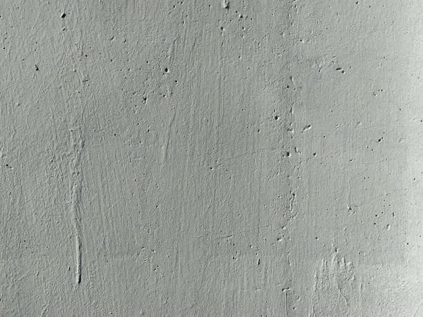 风化混凝土灰色墙面背景有裂缝和划痕。最小的背景照片。图片下载