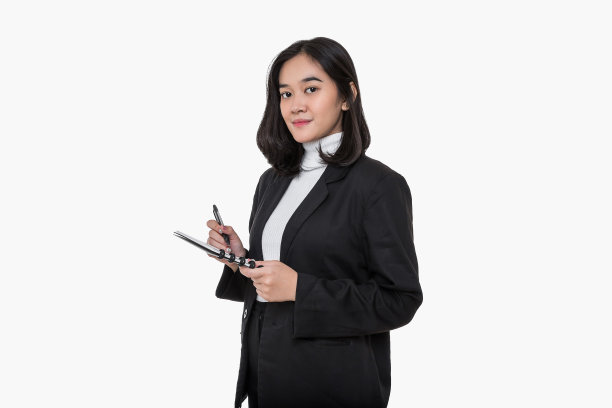 年轻的亚洲女商人拿着记事本和笔图片下载