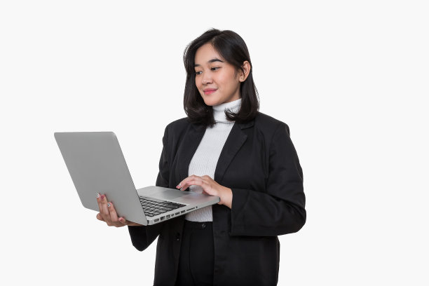 商务亚洲女性站着用电脑。图片下载