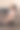 一位怀抱婴儿的年轻母亲远程在家用电脑工作图片下载