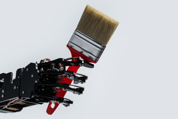 真正的机械手和画笔。人工智能发展或人工智能取代工作的概念图片下载