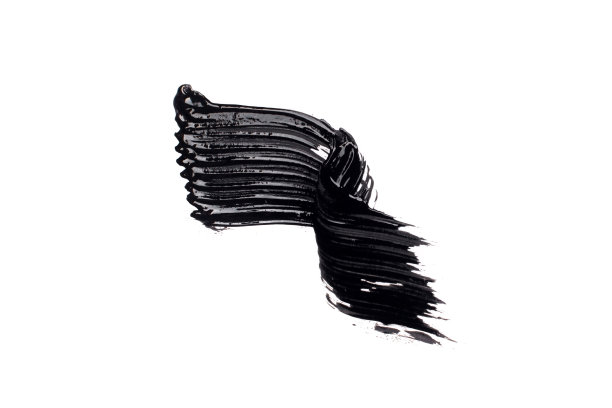 黑色的睫毛膏涂抹在白色的背景上图片下载