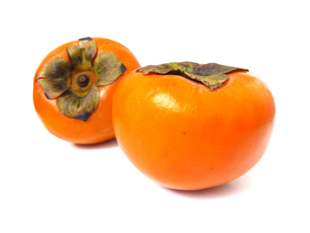 熟透的柿子果实在白色背景上的特写。图片下载