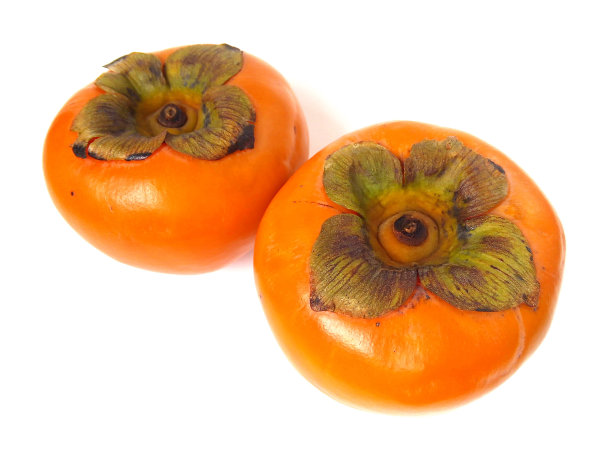 熟透的柿子果实在白色背景上的特写。图片下载