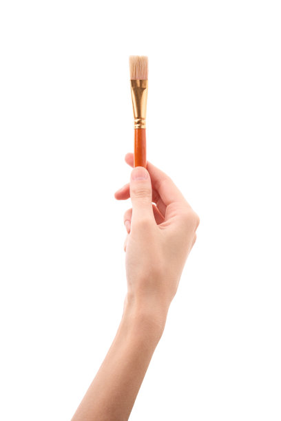 女性的手与刷在白色的背景。用手刷图片下载