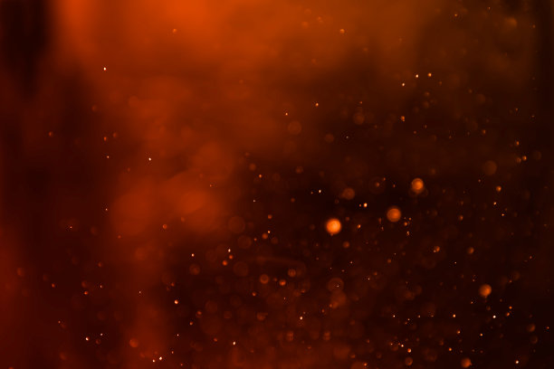 橙棕色散景闪光背景。图片下载