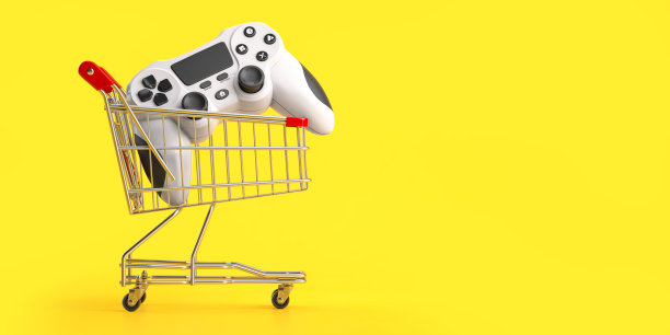 黄色背景的购物车里的操纵杆游戏控制器。购买网络视频游戏的概念。图片下载
